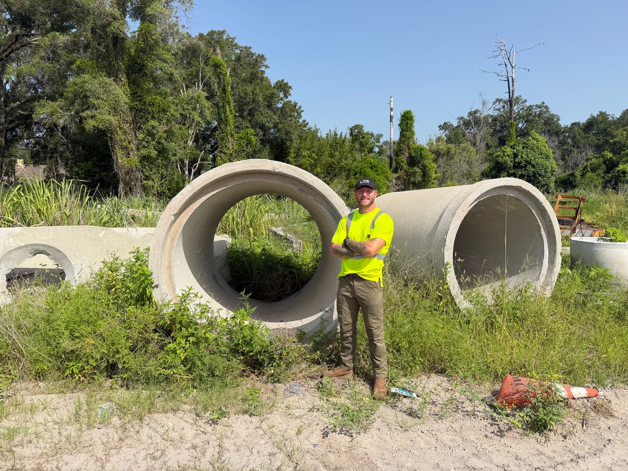 LES founder Michael Feltner with reinforced concrete stormwater pipe at a Central Florida site