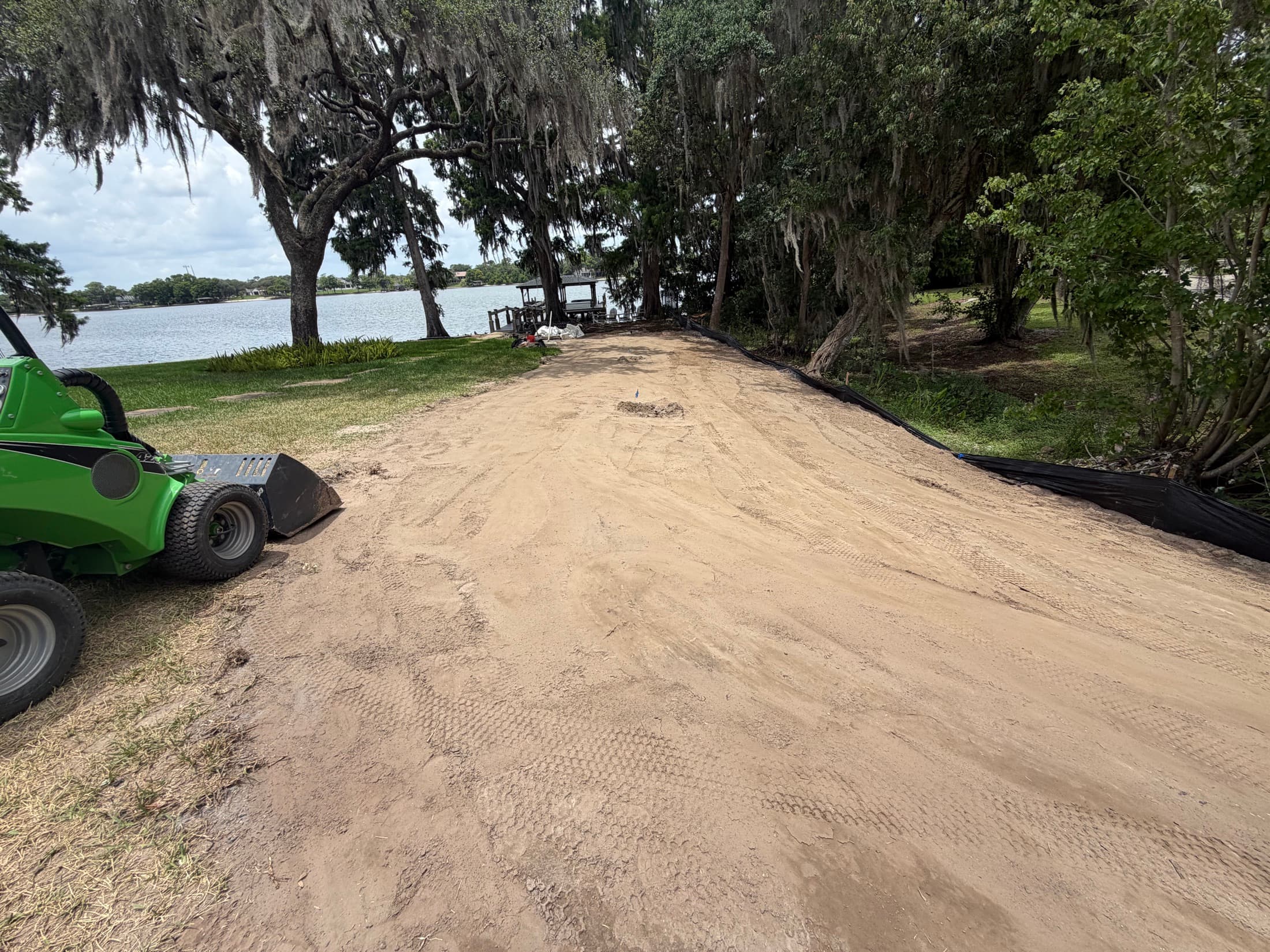 LES erosion control and shoreline grading with equipment at a Central Florida site